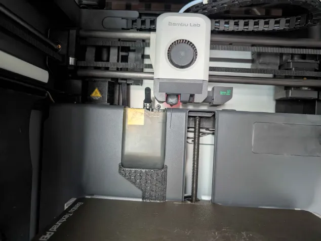 Inside my Bambu Lab X1 Carbon showing the toolhead and printed PETG part inside the chamber